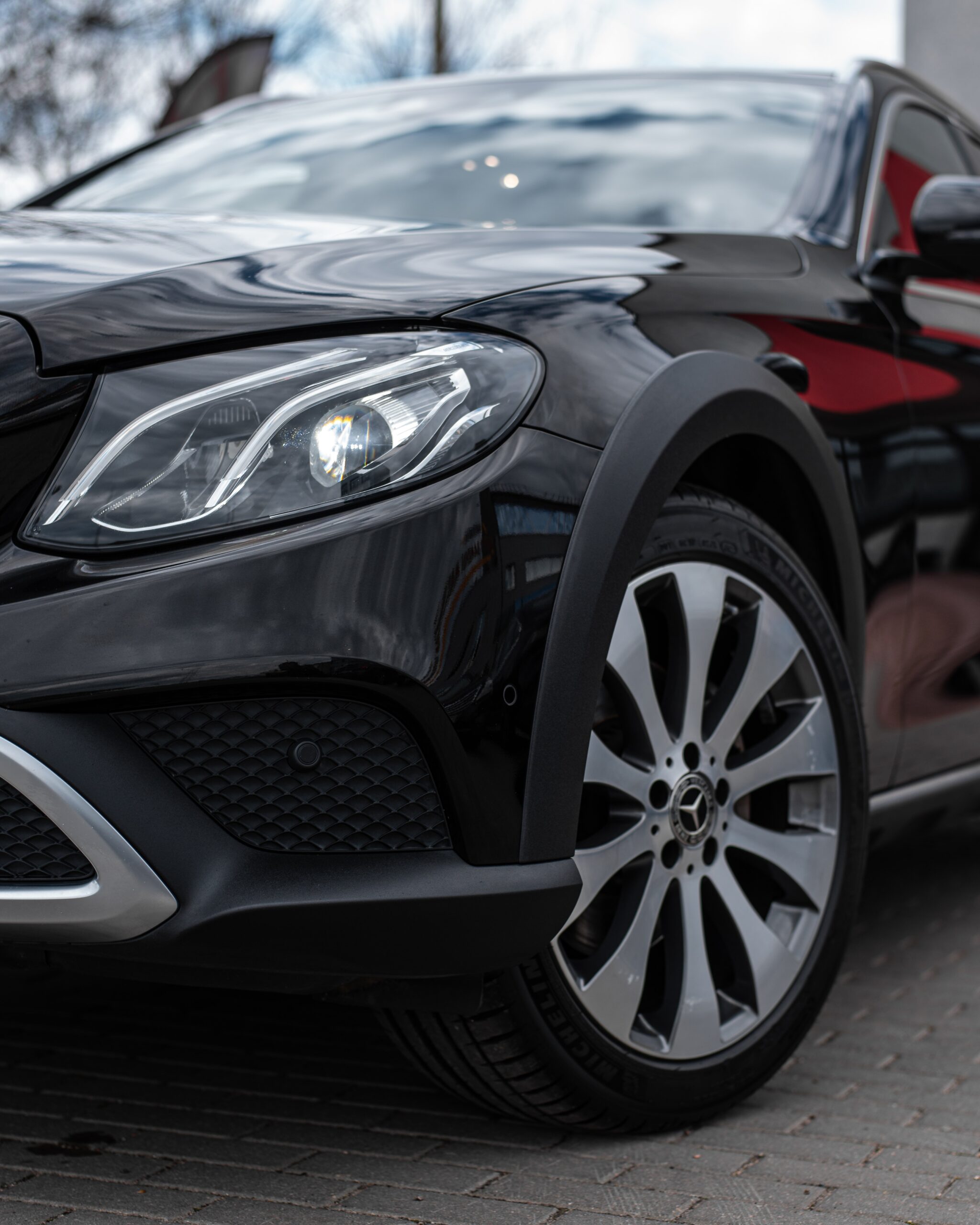 Closeup of luxury car headlights, modern LED lighting, premium vehicle design, high-end automotive showcase
