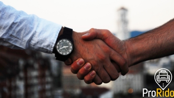 Two people shaking hands, professional handshake symbolizing business partnership and deal closure