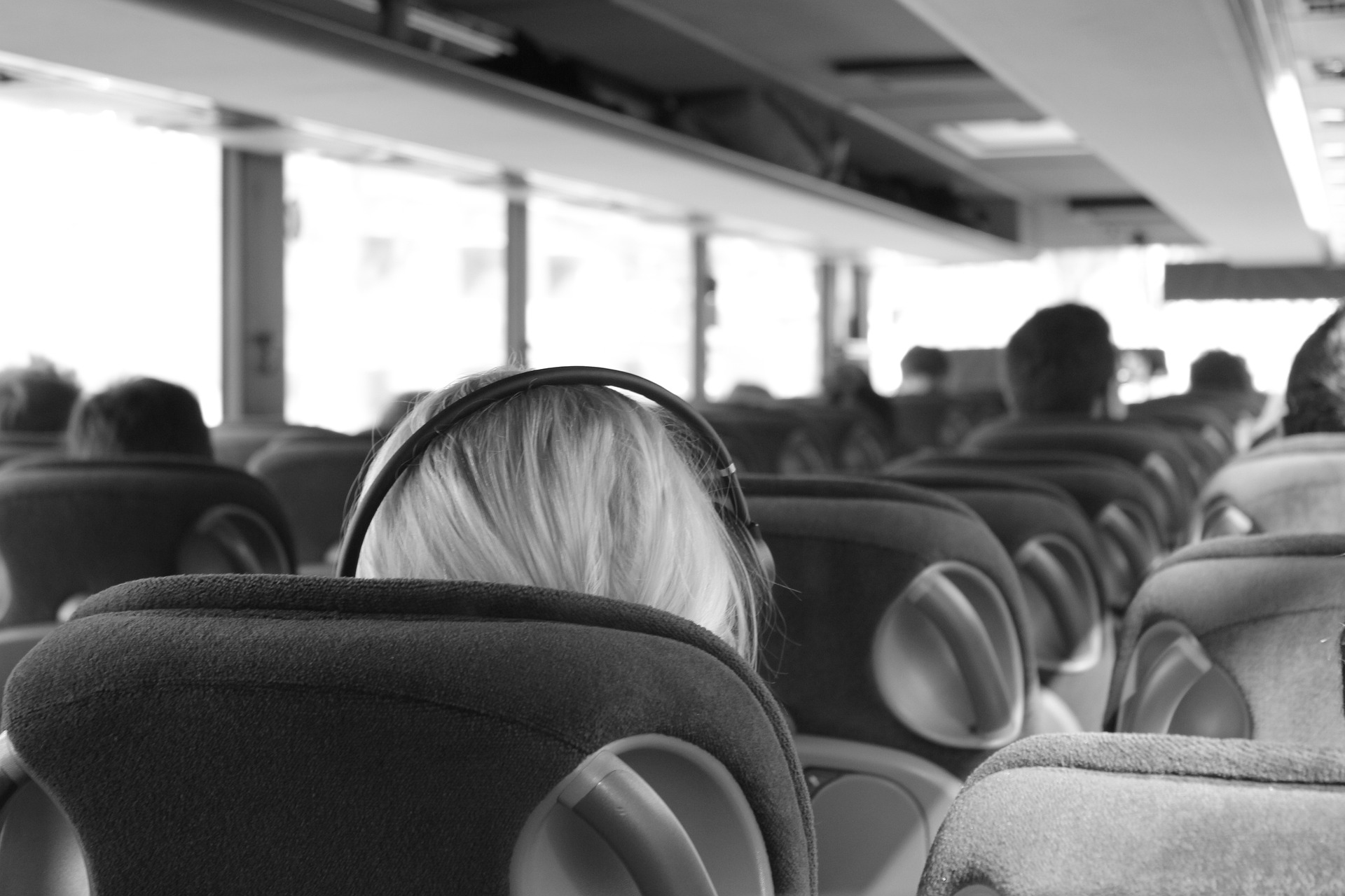 Many passengers sitting in bus and enjoying the ride, group travel, comfort, public transportation blog