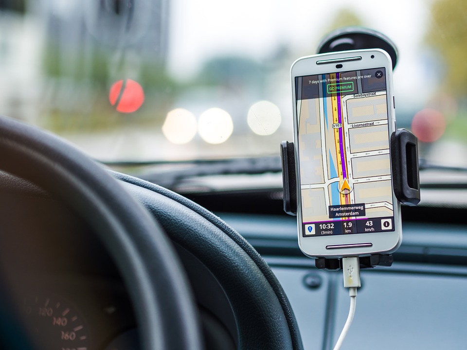Cab interior showing Google Maps navigation active on dashboard, real-time taxi route, live GPS navigation banner