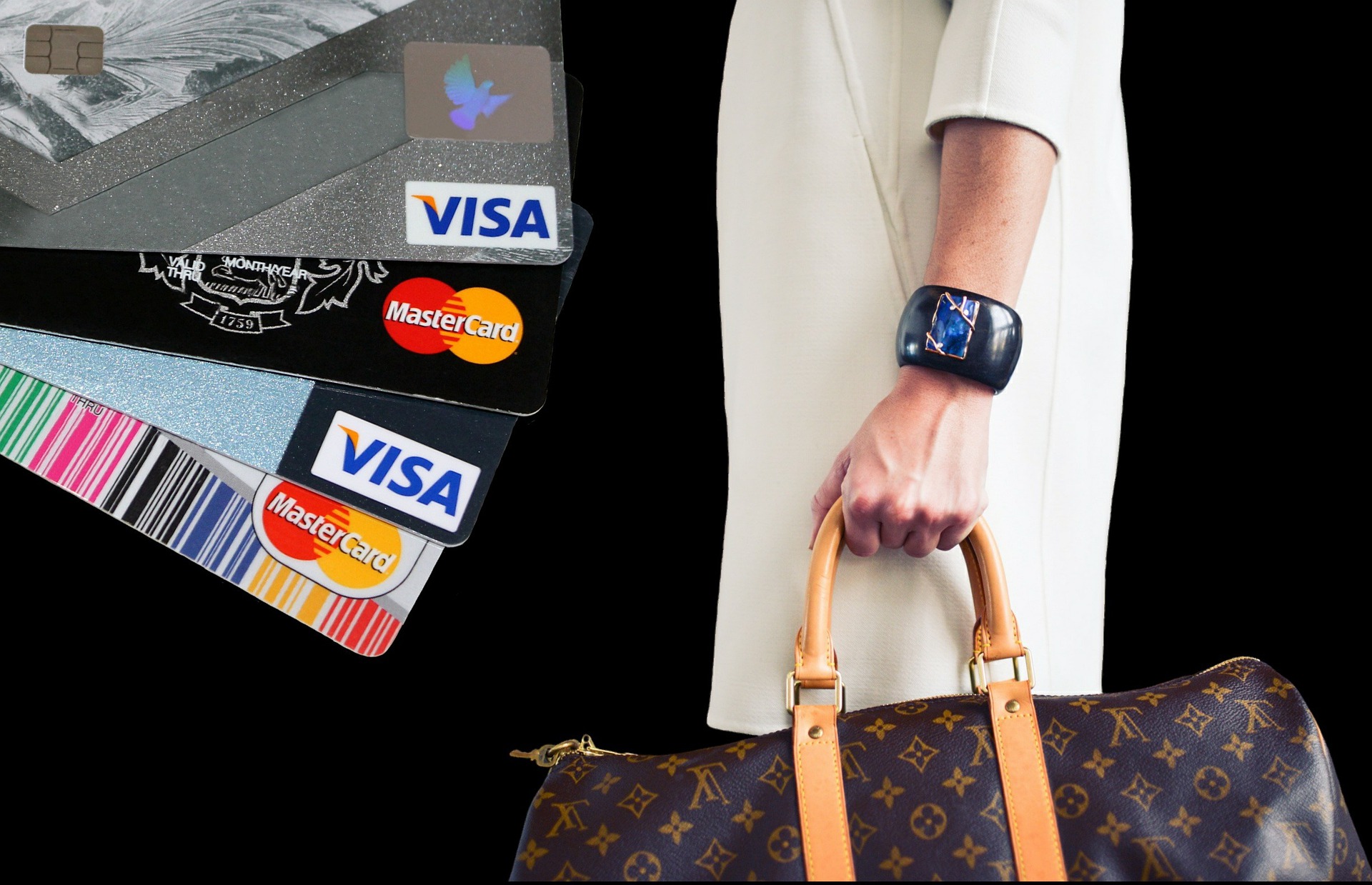 Shopper holding multiple credit cards with luxury bag, premium shopping and payment concept