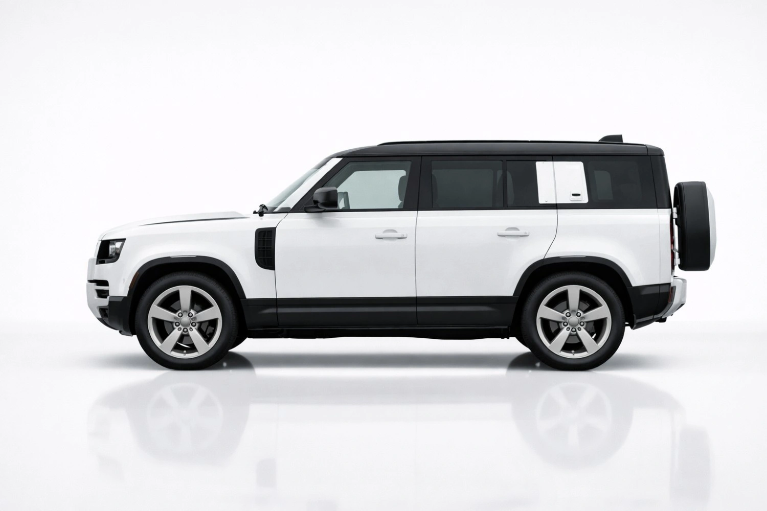 Land Rover Defender side profile displaying boxy silhouette and rugged SUV proportions
