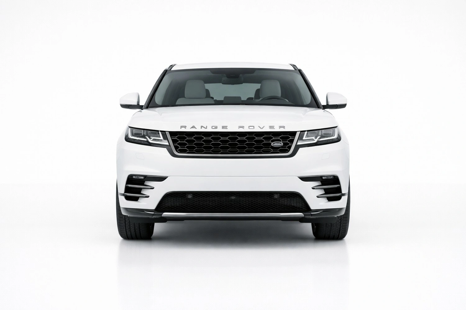 Range Rover Sport front view showing bold grille, sharp LED headlights, and athletic stance