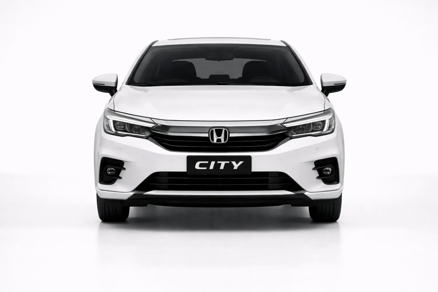 Honda City front view showing chrome grille, LED headlights, and premium sedan stance