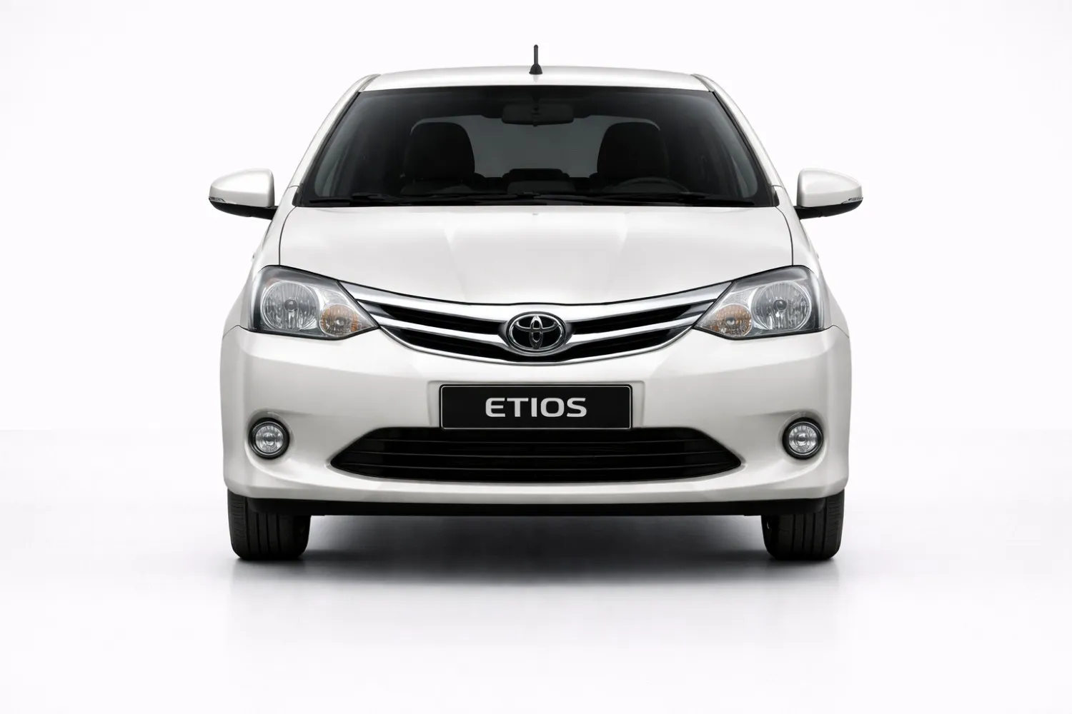 Toyota Etios front view showing compact grille, clear headlights, and sedan stance